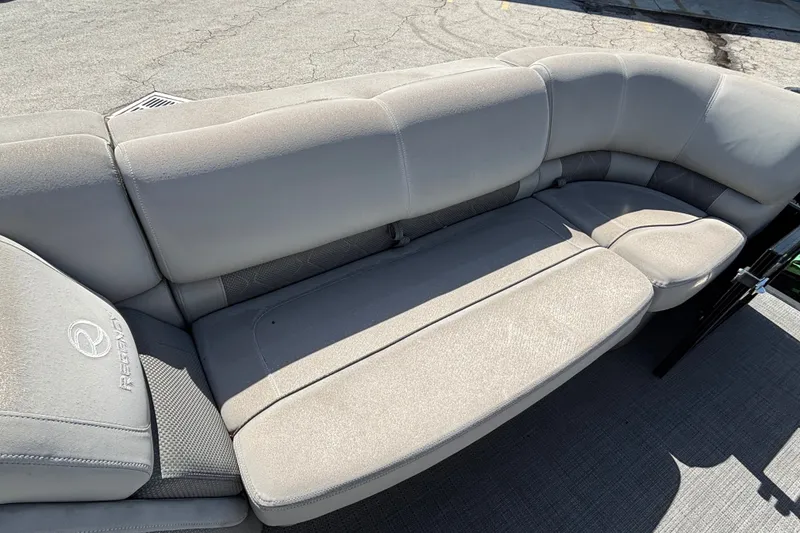 Slide: The Image of 2023 Regency 230 LE3 Sport boat seating, featuring plush gray upholstery and spacious design. - 8