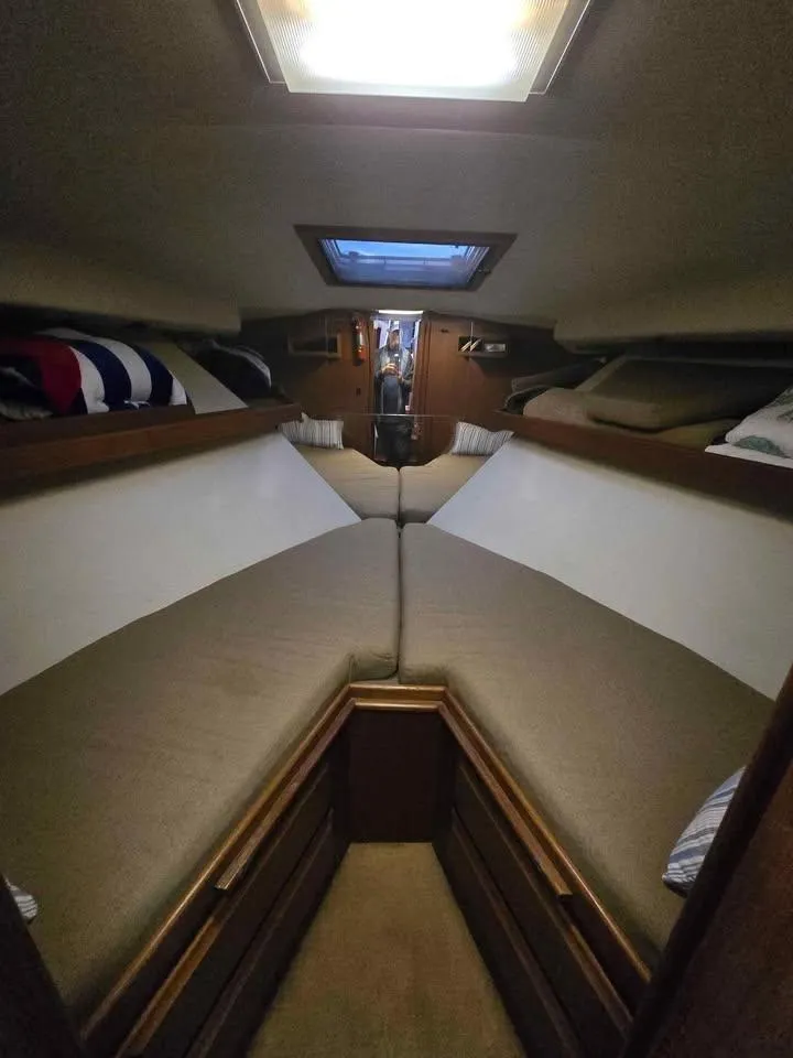 Slide: The Image of Interior of a 1990 Viking 35 boat cabin with cozy V-berth and skylight. - 126