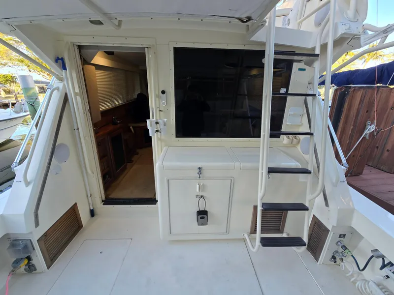 Slide: The Image of 1990 Viking 35 boat interior with stairs and cabin entrance. - 23