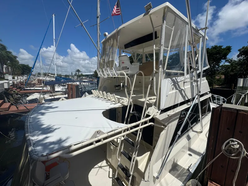 Slide: The Image of 1990 Viking 35 yacht docked under clear blue sky. - 30