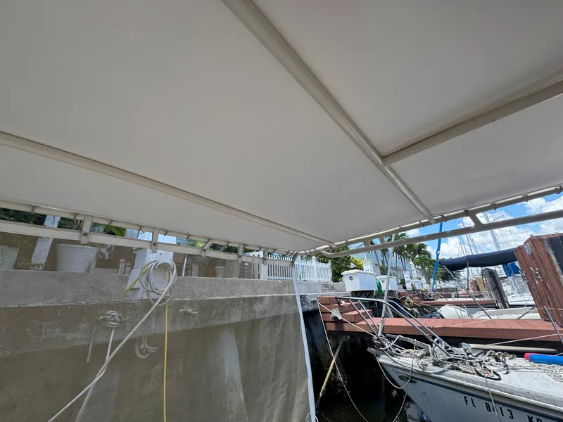 Slide: The Image of Boat docked at marina with covered deck, Viking 35, 1990 model. - 34