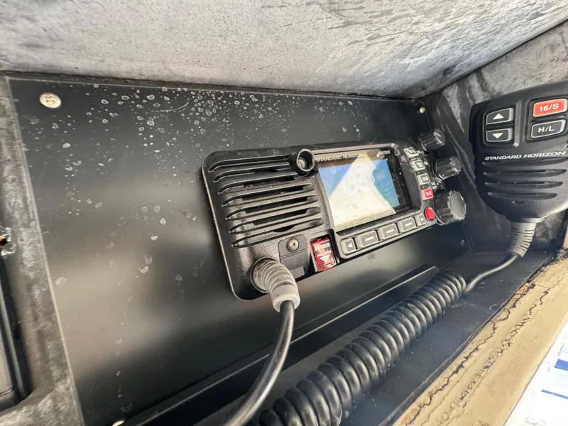 Slide: The Image of VHF marine radio setup on a 1990 Viking 35 boat, featuring Standard Horizon equipment. - 43