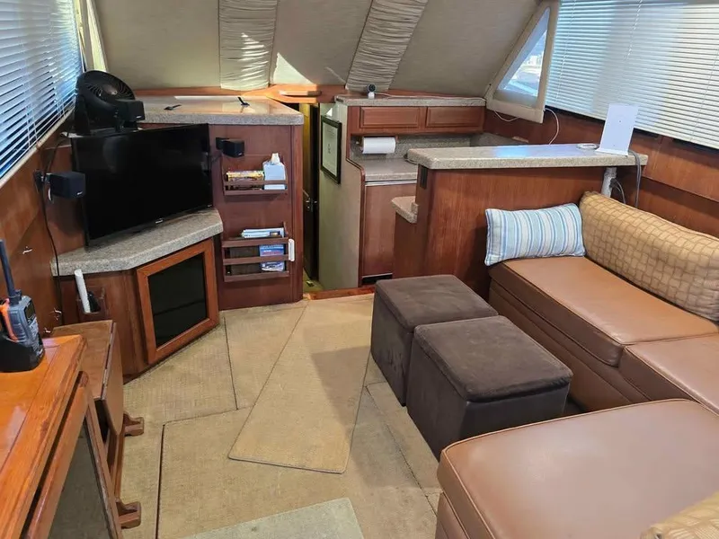 Slide: The Image of Interior of a 1990 Viking 35 yacht with cozy seating and modern amenities. - 87