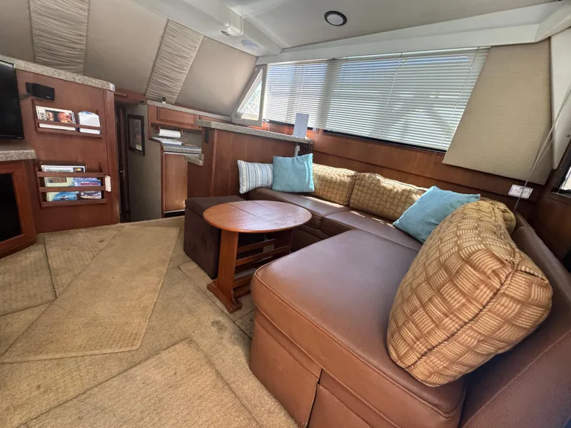 Slide: The Image of Luxurious interior of a 1990 Viking 35 yacht with cozy seating and elegant decor. - 91