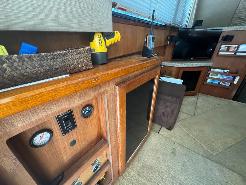 Slide: The Image of Interior of a 1990 Viking 35 boat with wooden cabinetry and modern electronics. - 92