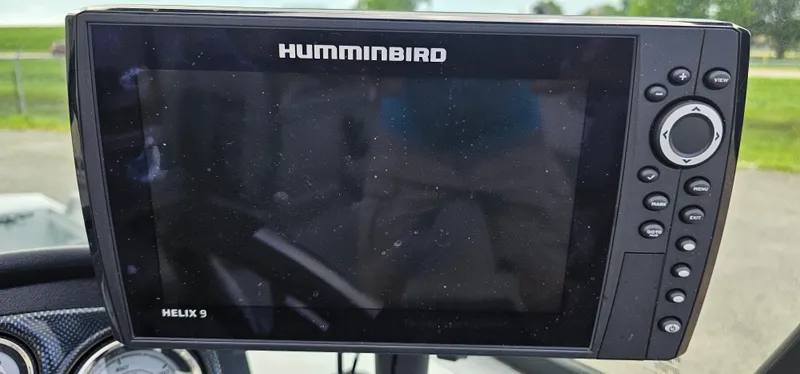 Slide: The Image of Humminbird Helix 9 fish finder on 2024 G3 Sportsman 2100 boat dashboard. - 12