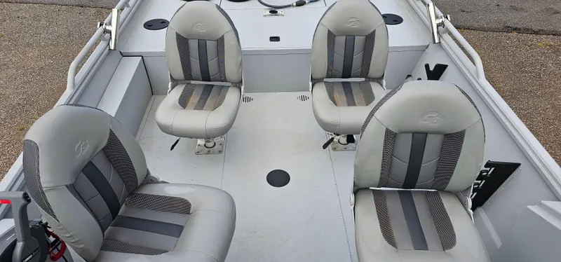 Slide: The Image of 2024 G3 Sportsman 2100 boat interior with four cushioned seats. - 13