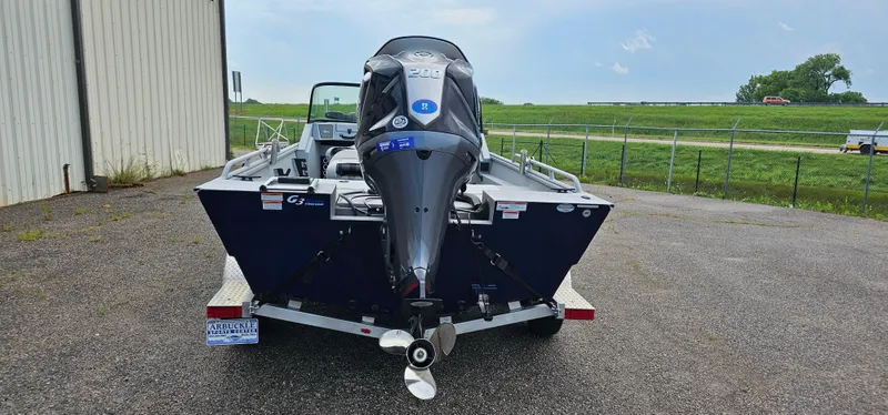 Slide: The Image of 2024 G3 Sportsman 2100 boat on trailer, rear view, outdoors. - 3