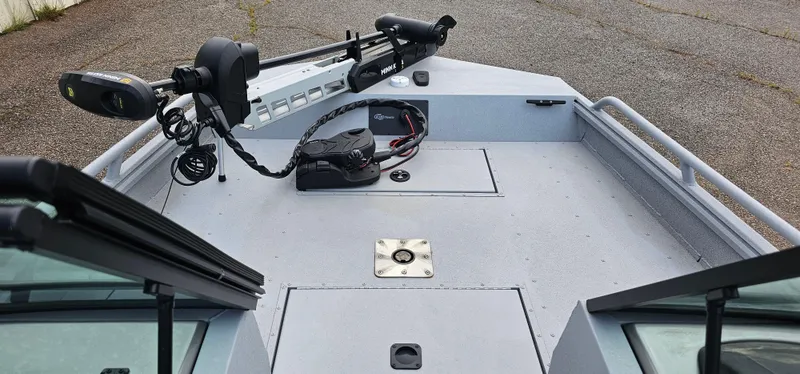 Slide: The Image of 2024 G3 Sportsman 2100 boat interior with trolling motor and storage compartments. - 4