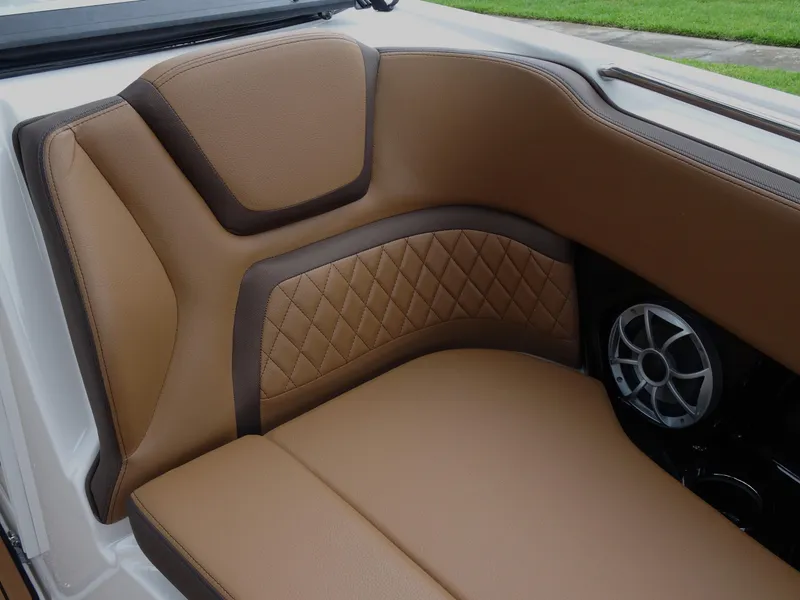 Slide: The Image of 2024 Yamaha Boats 252SE interior with tan leather seating and speaker detail. - 13
