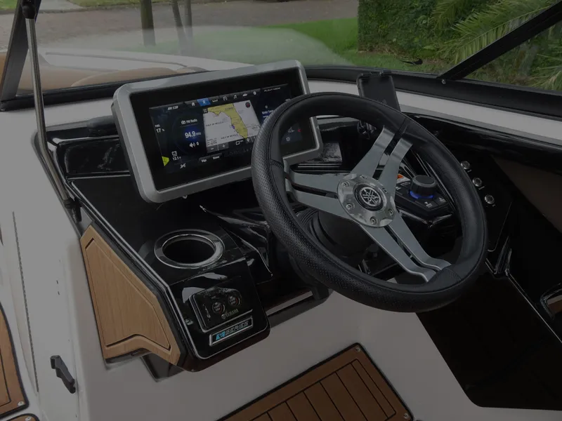 Slide: The Image of 2024 Yamaha Boats 252SE dashboard with steering wheel and touchscreen display. - 15