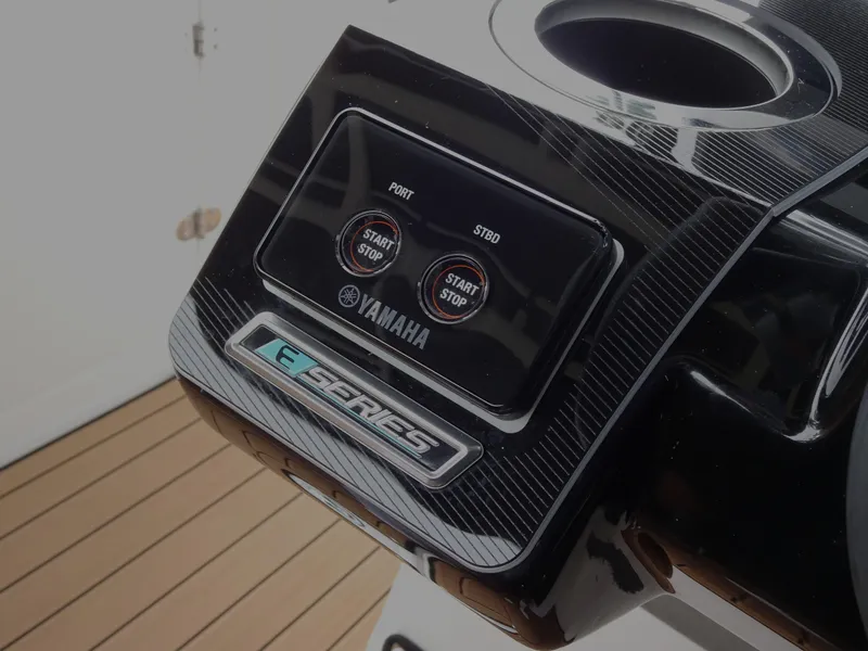 Slide: The Image of 2024 Yamaha Boats 252SE control panel with start/stop buttons and sleek design. - 24
