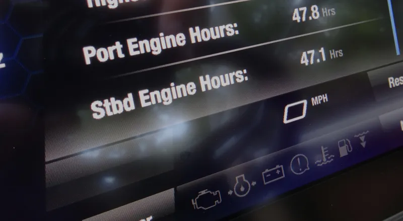 Slide: The Image of Display screen of 2024 Yamaha Boats 252SE showing engine hours and icons. - 25