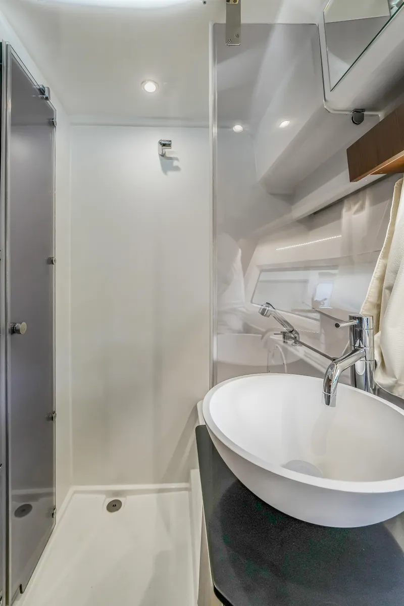 Slide: The Image of 2024 Jeanneau NC1095 Fly bathroom with modern sink and shower. - 12