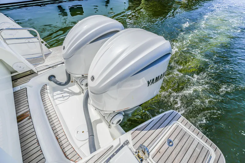Slide: The Image of 2024 Jeanneau NC1095 Fly with dual Yamaha outboard engines on water. - 24