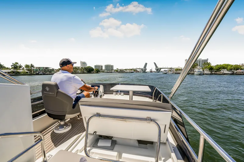 Slide: The Image of 2024 Jeanneau NC1095 Fly cruising on a sunny day with a scenic waterfront view. - 27