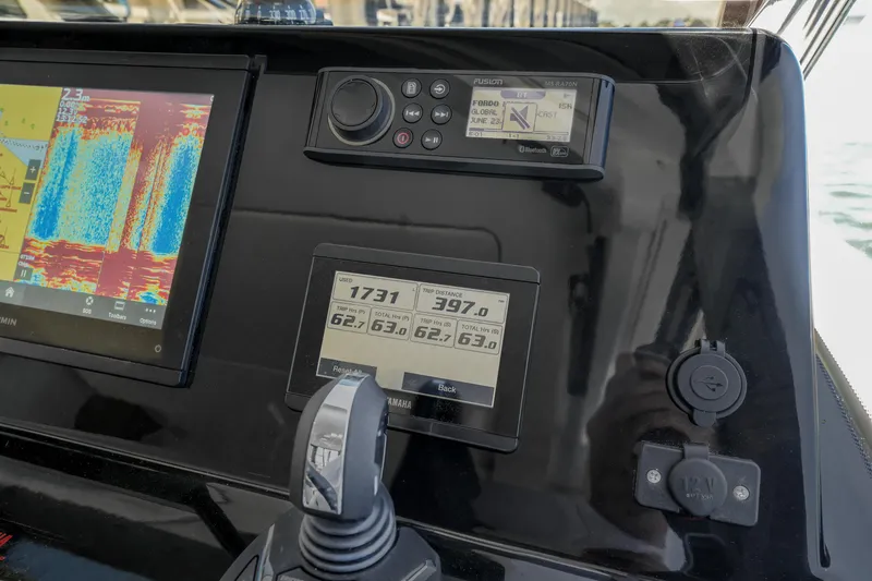 Slide: The Image of Control panel of 2024 Jeanneau NC1095 Fly with navigation and engine displays. - 36