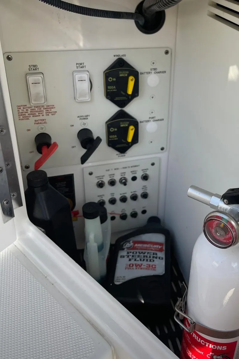 Slide: The Image of Control panel and supplies in a 2020 Formula 310 Bowrider boat. - 12