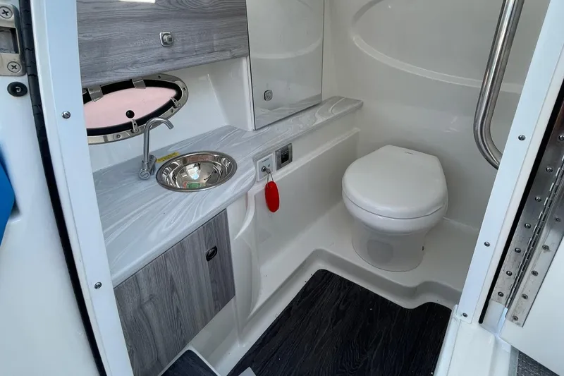Slide: The Image of 2020 Formula 310 Bowrider bathroom with sink, toilet, and modern design. - 14