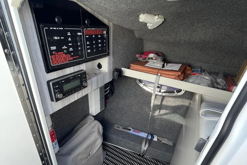 Slide: The Image of Interior cabin of 2020 Formula 310 Bowrider with control panels and storage. - 15