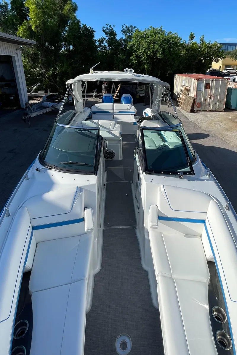 Slide: The Image of 2020 Formula 310 Bowrider boat with spacious seating and sleek design. - 18