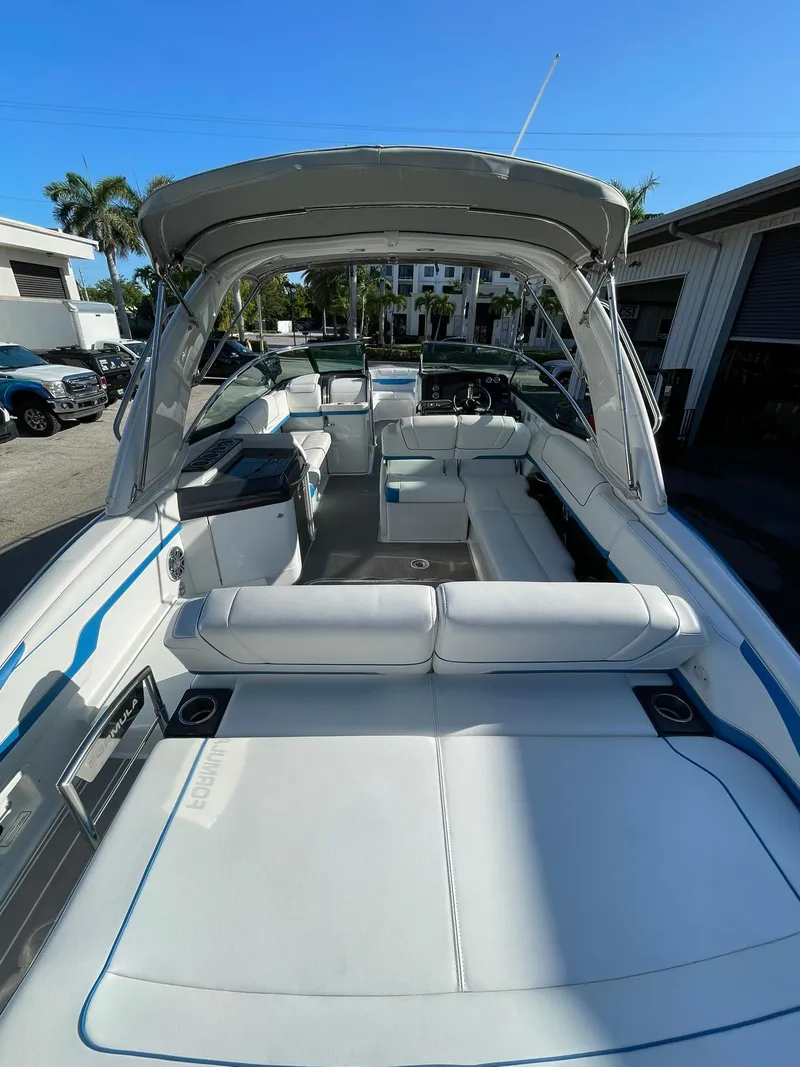 Slide: The Image of 2020 Formula 310 Bowrider boat with spacious seating and sleek design. - 20