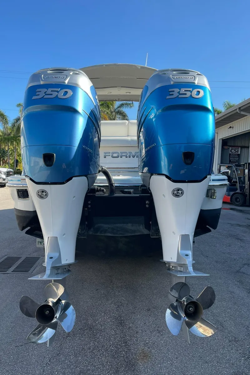 Slide: The Image of 2020 Formula 310 Bowrider with twin 350 horsepower outboard engines, rear view. - 23