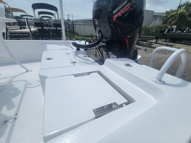 Slide: The Image of Blazer Bay 2020 boat with Mercury Pro engine, 2025 model, in a marina setting. - 15