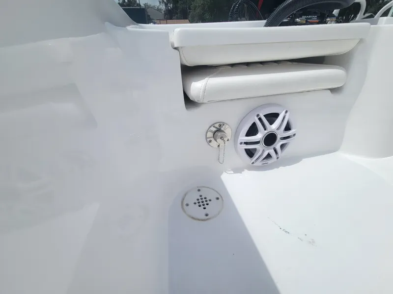 Slide: The Image of Interior of Blazer Bay 2020 boat, featuring speaker and seating, 2025 model. - 19