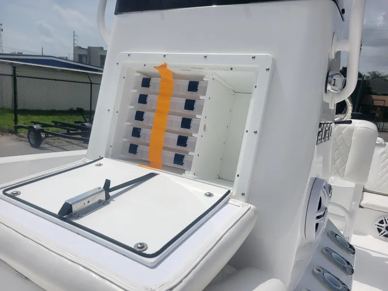 Slide: The Image of 2025 Blazer Bay boat console with storage compartments and control panel. - 9