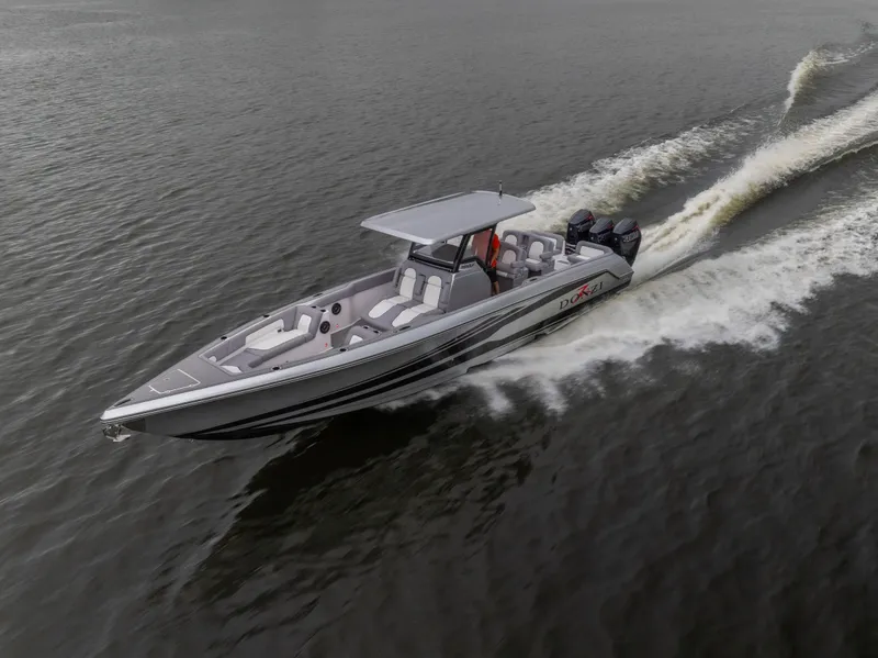 Slide: The Image of 2025 Donzi 39 VRZ speedboat cruising on open water, showcasing sleek design and powerful engines. - 11