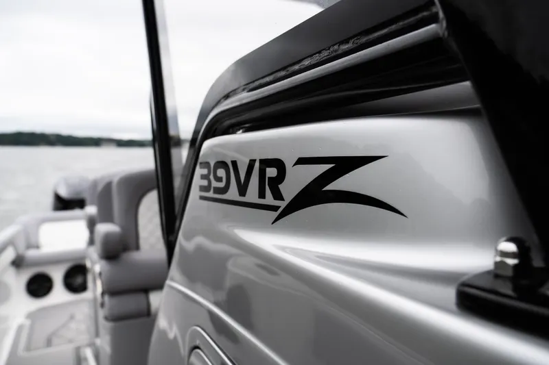 Slide: The Image of 2025 Donzi 39 VRZ boat detail on water, showcasing sleek design. - 18