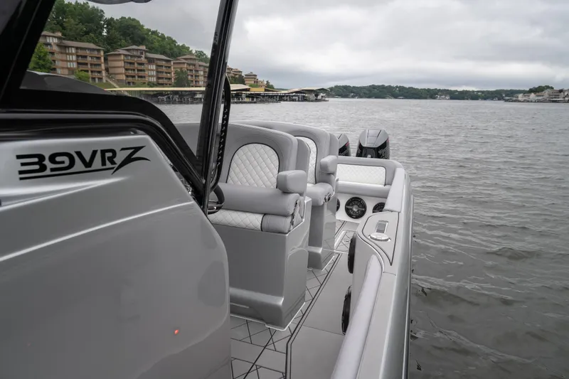 Slide: The Image of 2025 Donzi 39 VRZ boat on a lake, featuring sleek design and luxurious seating. - 20