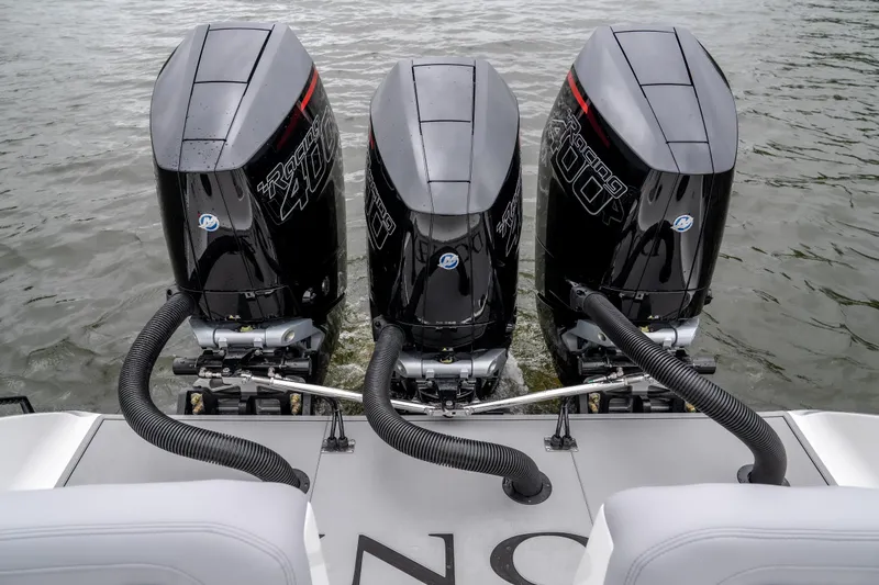 Slide: The Image of Triple outboard engines on a 2025 Donzi 39 VRZ boat, viewed from the rear. - 23