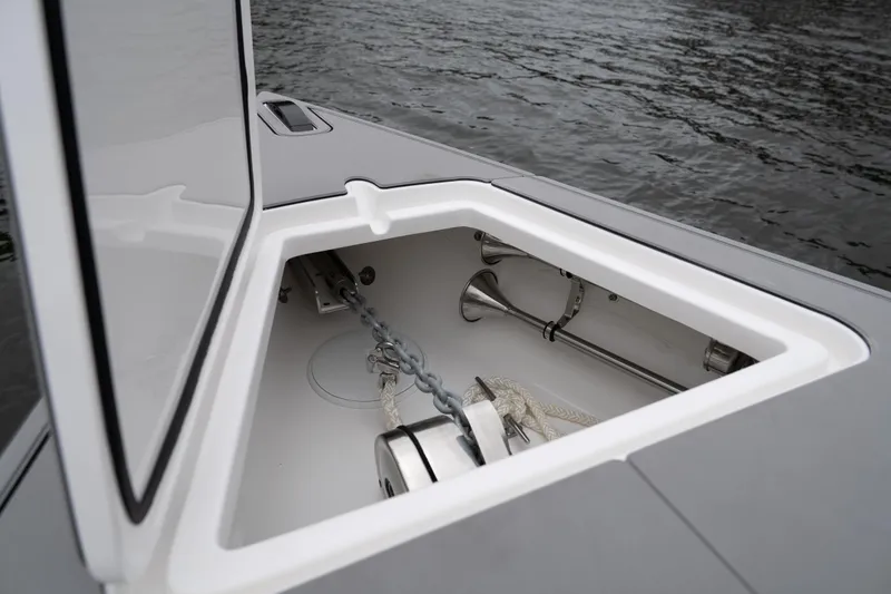 Slide: The Image of Anchor compartment of 2025 Donzi 39 VRZ boat, open on calm water. - 28