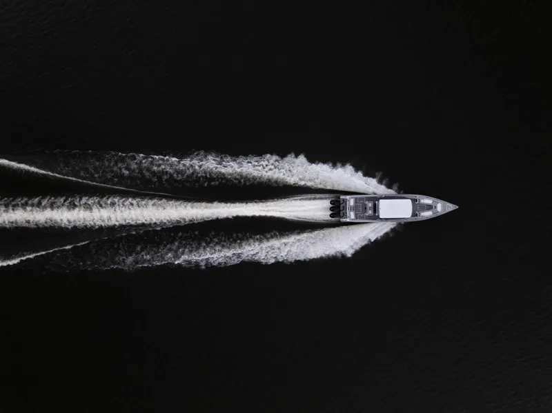 Slide: The Image of Aerial view of 2025 Donzi 39 VRZ speedboat cutting through dark water. - 3