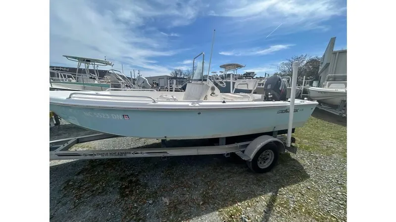 The Image of 2010 Sea Fox 172 Center Console boat on trailer, parked outdoors. - 0