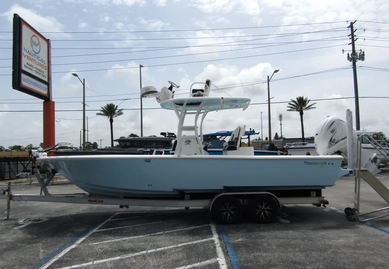 Slide: The Image of 2021 Tidewater 2700 Carolina Bay boat on trailer in parking lot. - 0