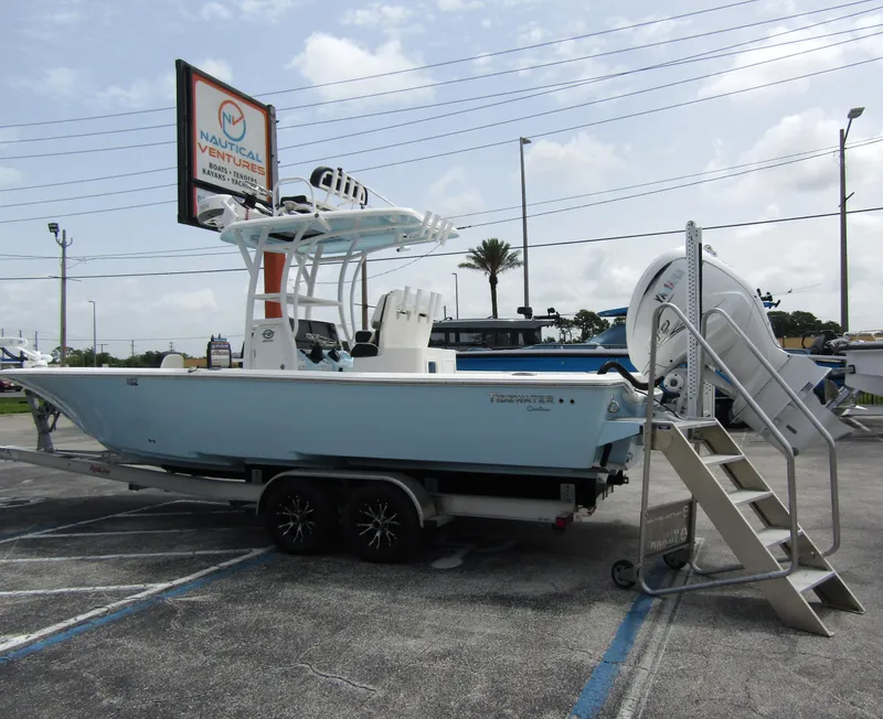 Slide: The Image of 2021 Tidewater 2700 Carolina Bay boat on trailer in parking lot. - 1