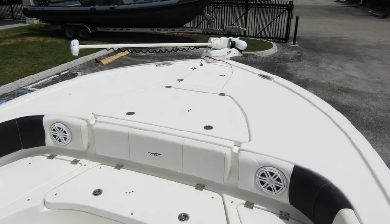 Slide: The Image of 2021 Tidewater 2700 Carolina Bay boat deck with speakers and storage compartments. - 13