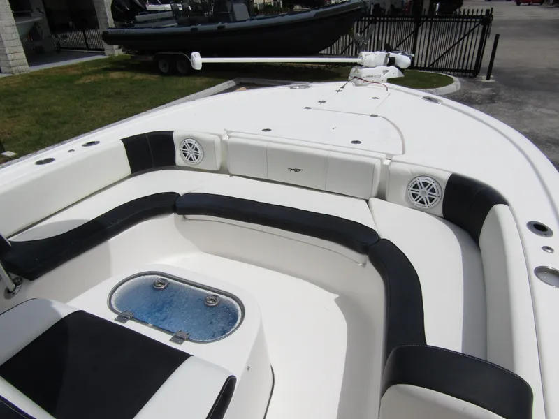 Slide: The Image of 2021 Tidewater 2700 Carolina Bay boat interior with seating and storage compartments. - 14
