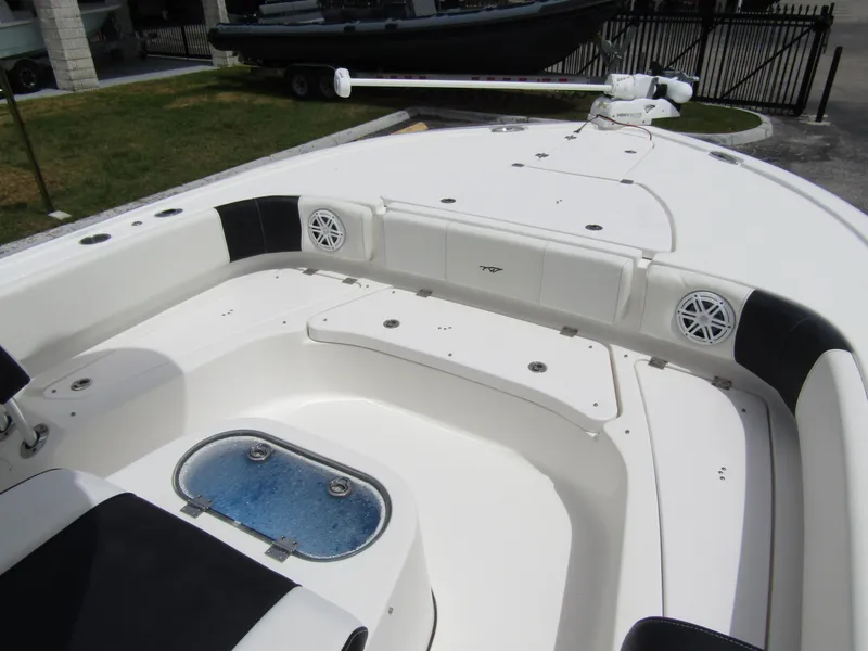 Slide: The Image of 2021 Tidewater 2700 Carolina Bay boat interior with seating and storage compartments. - 15