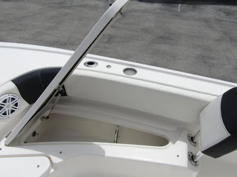 Slide: The Image of Open storage compartment on 2021 Tidewater 2700 Carolina Bay boat. - 16