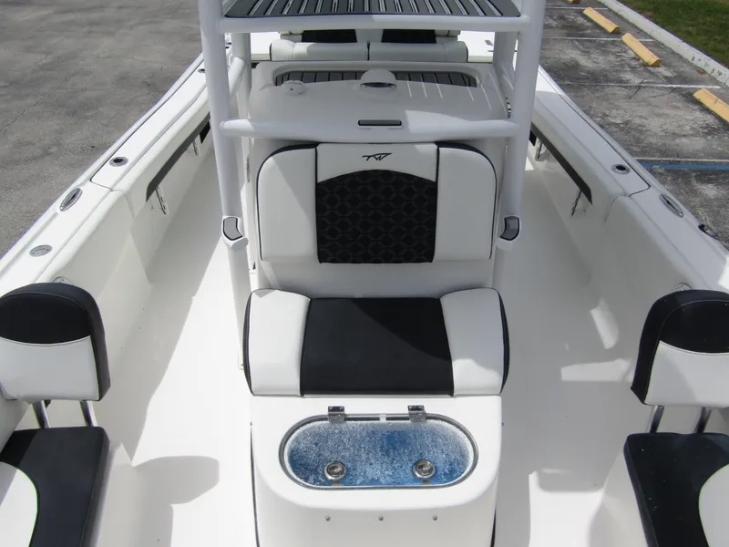 Slide: The Image of 2021 Tidewater 2700 Carolina Bay boat interior with seating and storage compartments. - 17