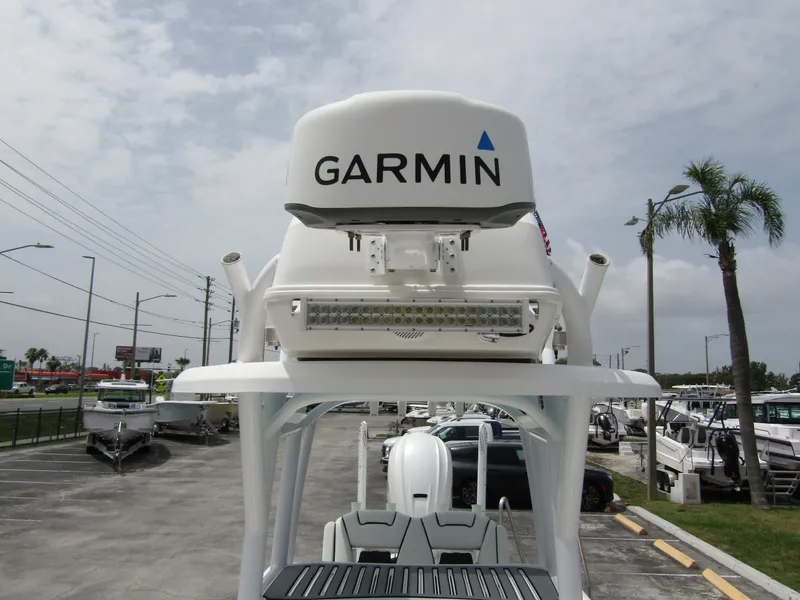 Slide: The Image of 2021 Tidewater 2700 Carolina Bay boat with Garmin radar, parked in a marina. - 18