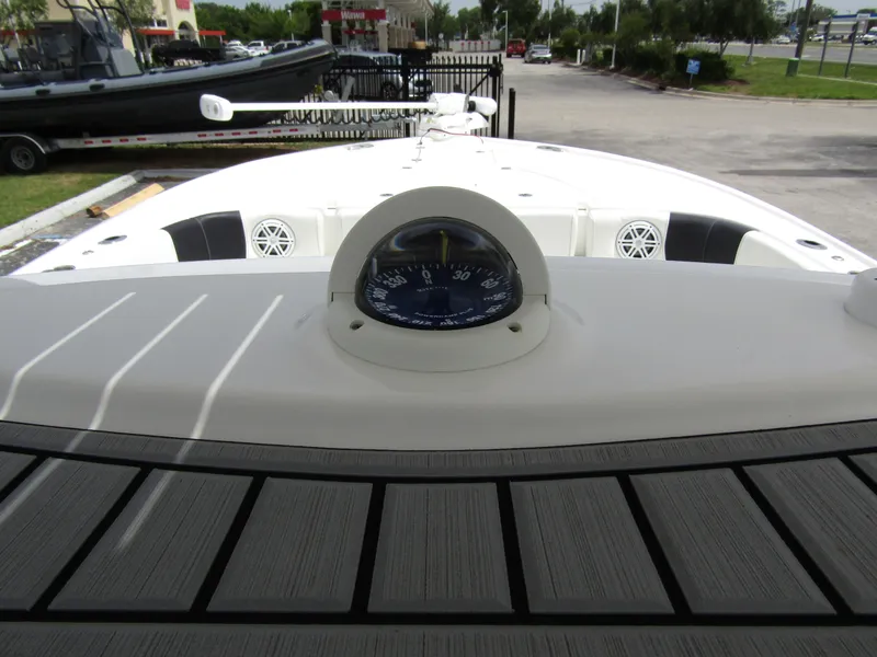 Slide: The Image of 2021 Tidewater 2700 Carolina Bay boat deck with compass and sleek design. - 24