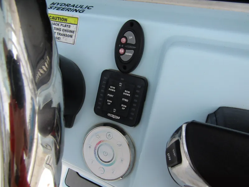 Slide: The Image of Control panel of 2021 Tidewater 2700 Carolina Bay boat with hydraulic steering. - 27