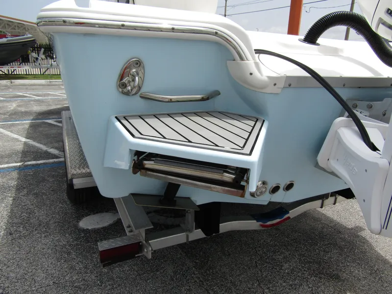 Slide: The Image of 2021 Tidewater 2700 Carolina Bay boat stern with swim platform and ladder. - 3