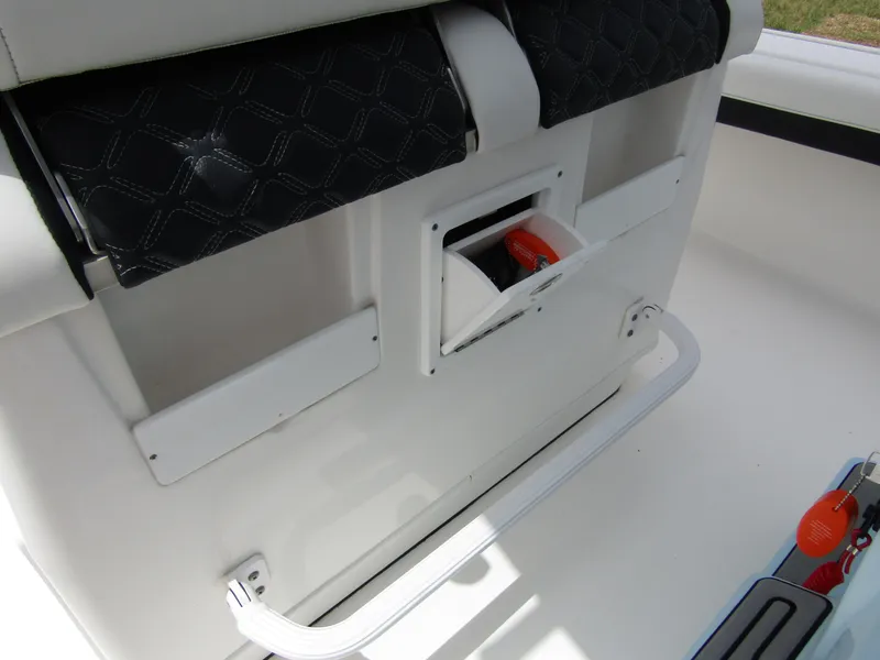 Slide: The Image of 2021 Tidewater 2700 Carolina Bay boat interior with storage compartment and seating. - 30