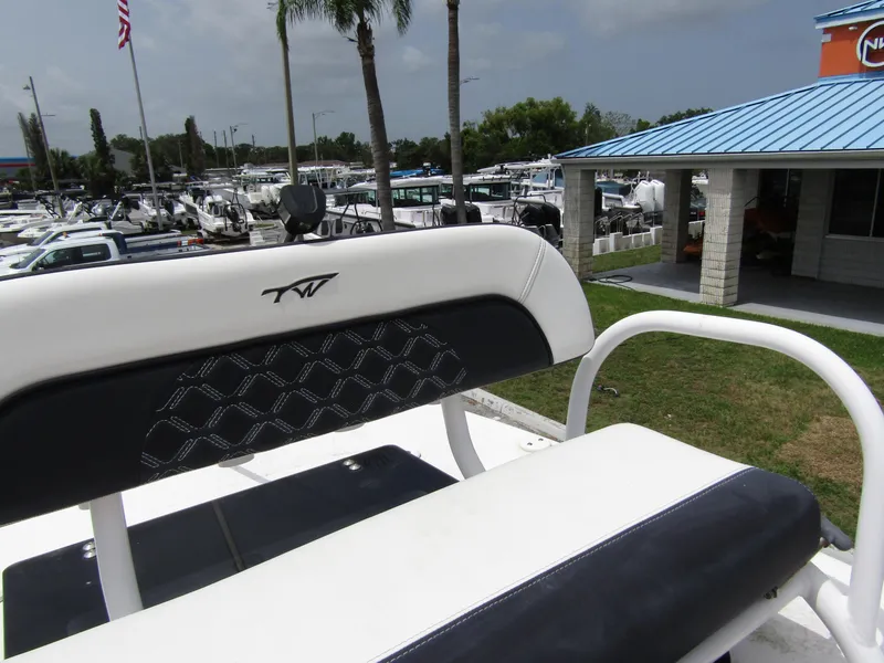 Slide: The Image of 2021 Tidewater 2700 Carolina Bay boat seat with marina background. - 32